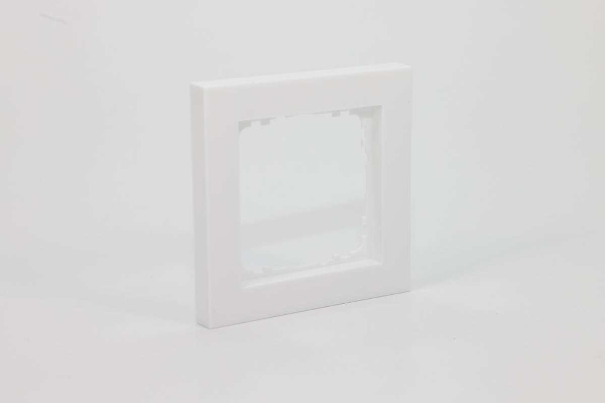 White single-gang frame for a 55 mm KNX wall control – left view